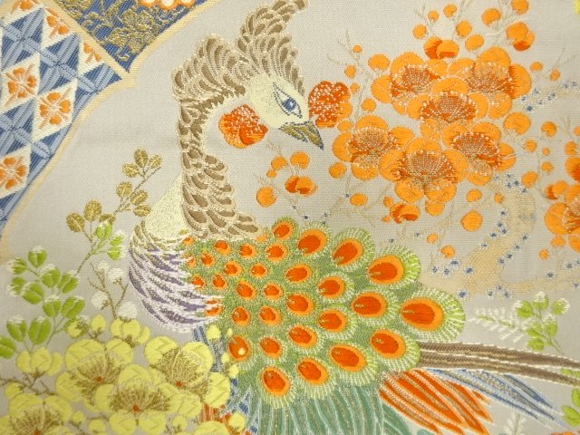  絵皿に孔雀・草花模様織り出し　袋帯